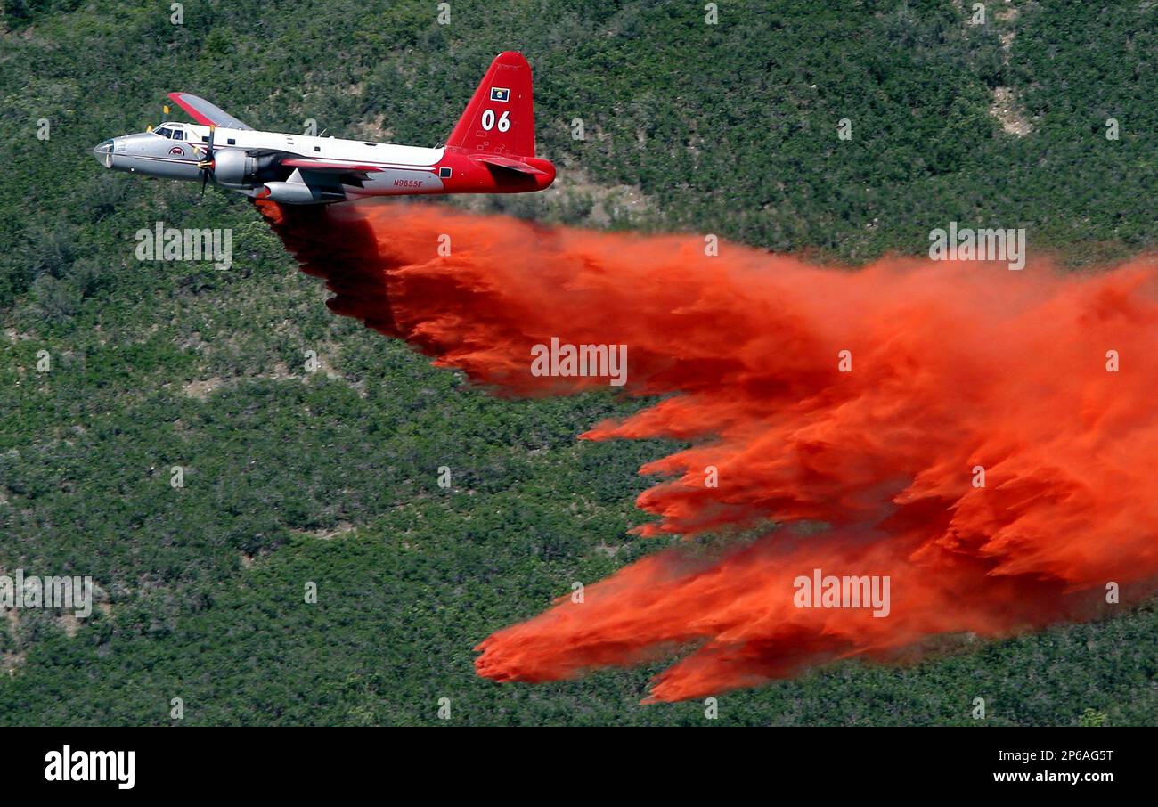 FILE In this July 3, 2012 photo, an aircraft makes a drop on the
