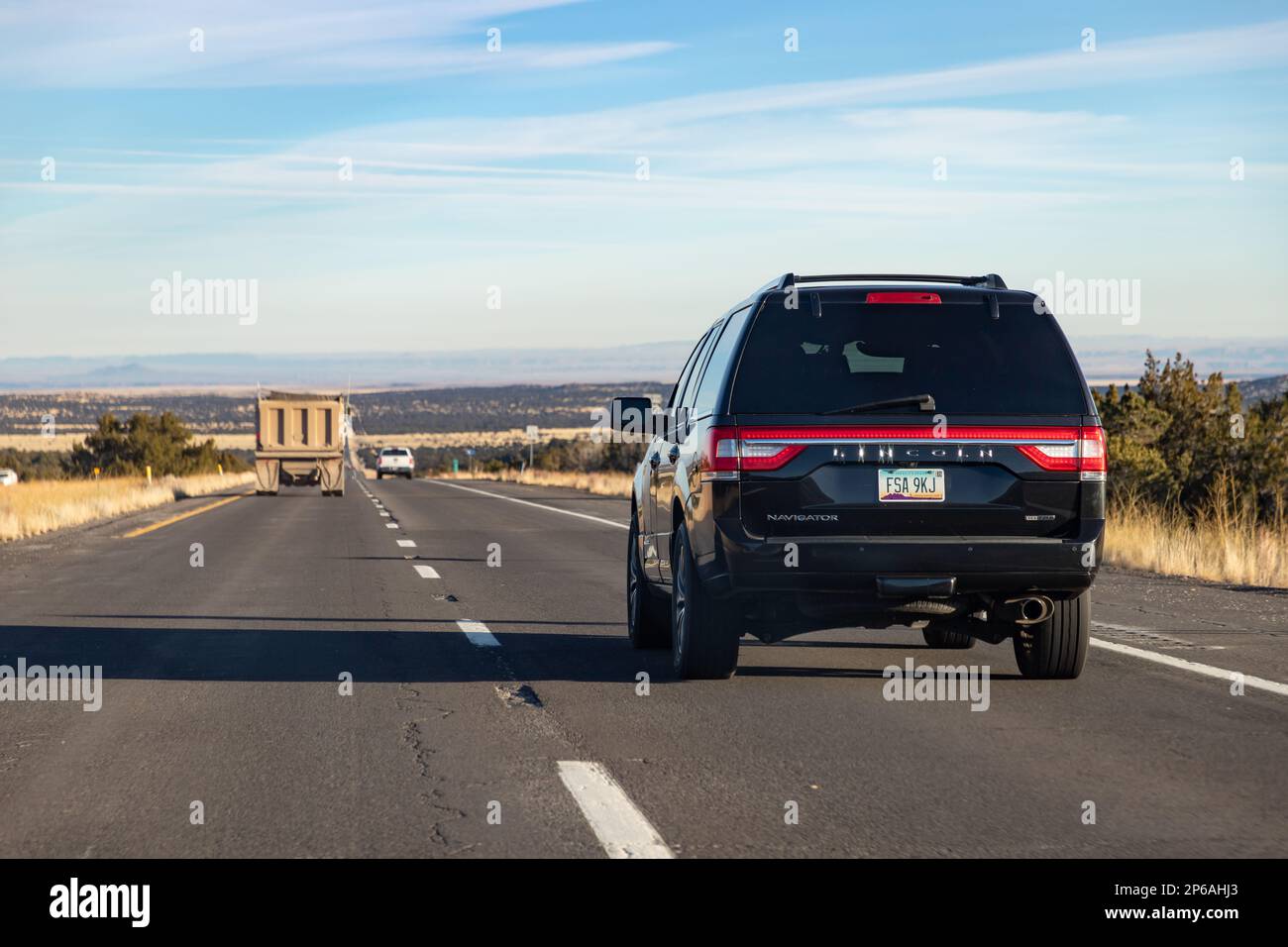 A picture of a black Lincoln Navigator EcoBoost driving in Arizona. Stock Photo
