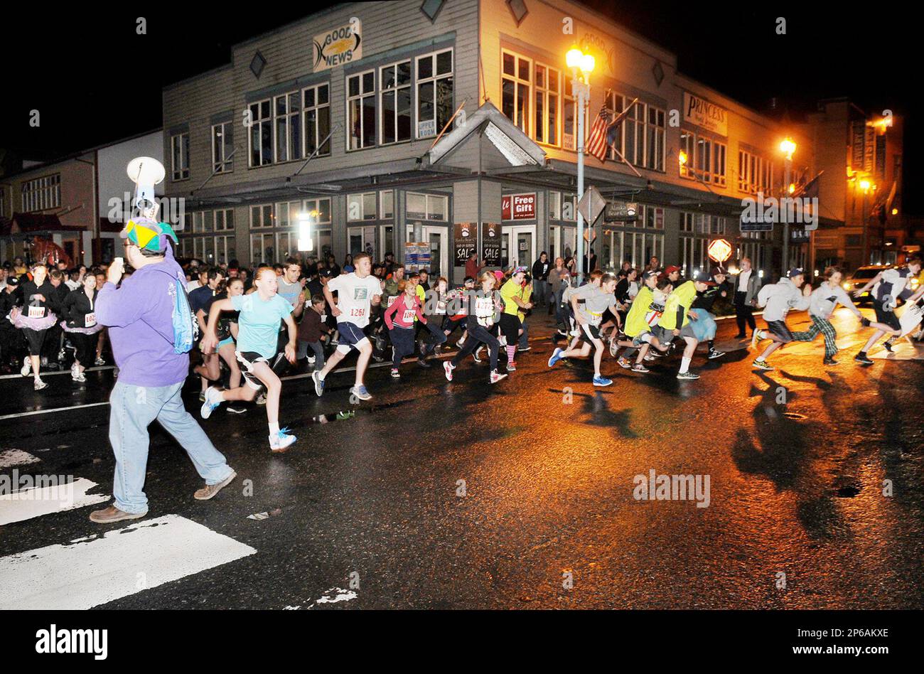 Race master Miguel Torres, holding bullhorn, left, starts the Only