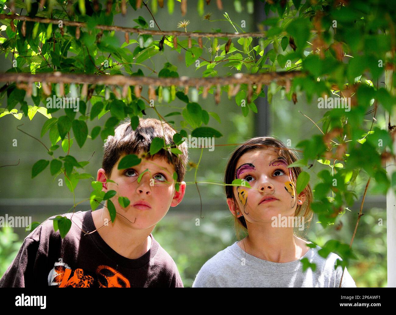 Ryan Smith, left, 10, and Clarissa Peterson, 9, look for emerging