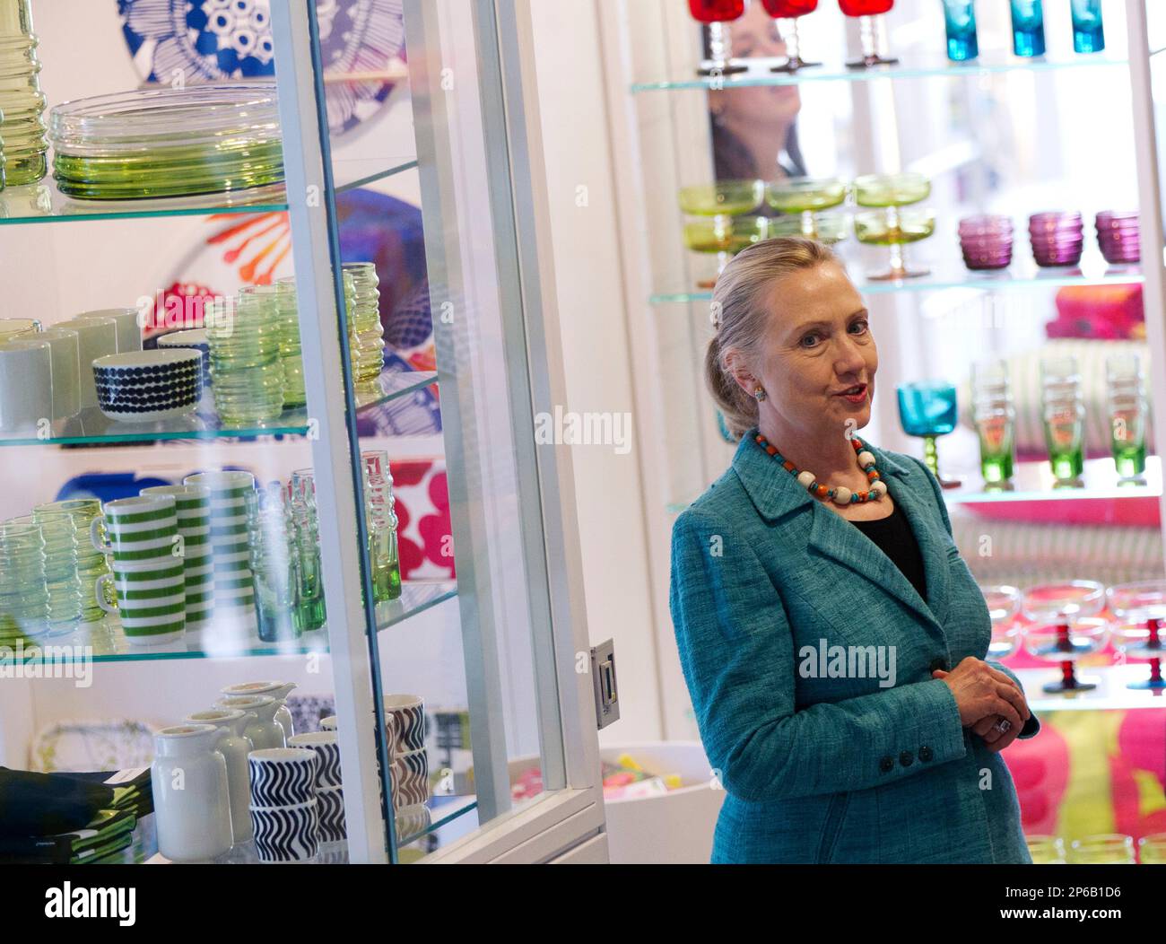 . Secretary of State Hillary Rodham Clinton receives a tour of the  Marimekko factory and showroom from company CEO Mika Ihamuotila, Wednesday,  June 27, 2012, in Helsinki, Finland. (AP Photo/Haraz N. Ghanbari,