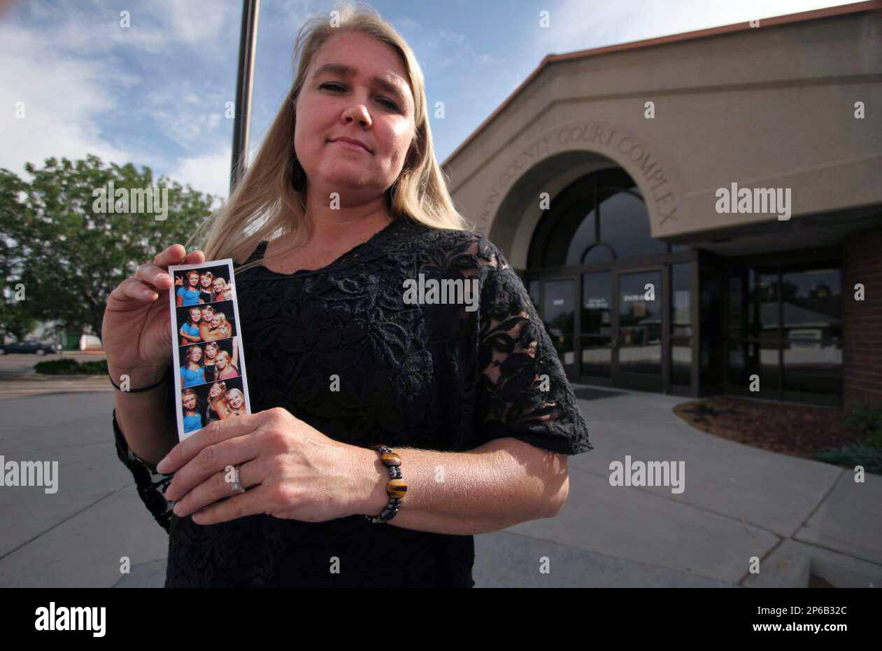 In this June 6 2012 photo Valerie Bruno holds a photo of her three In this June 6 2012 photo Valerie Bruno holds a photo of her three