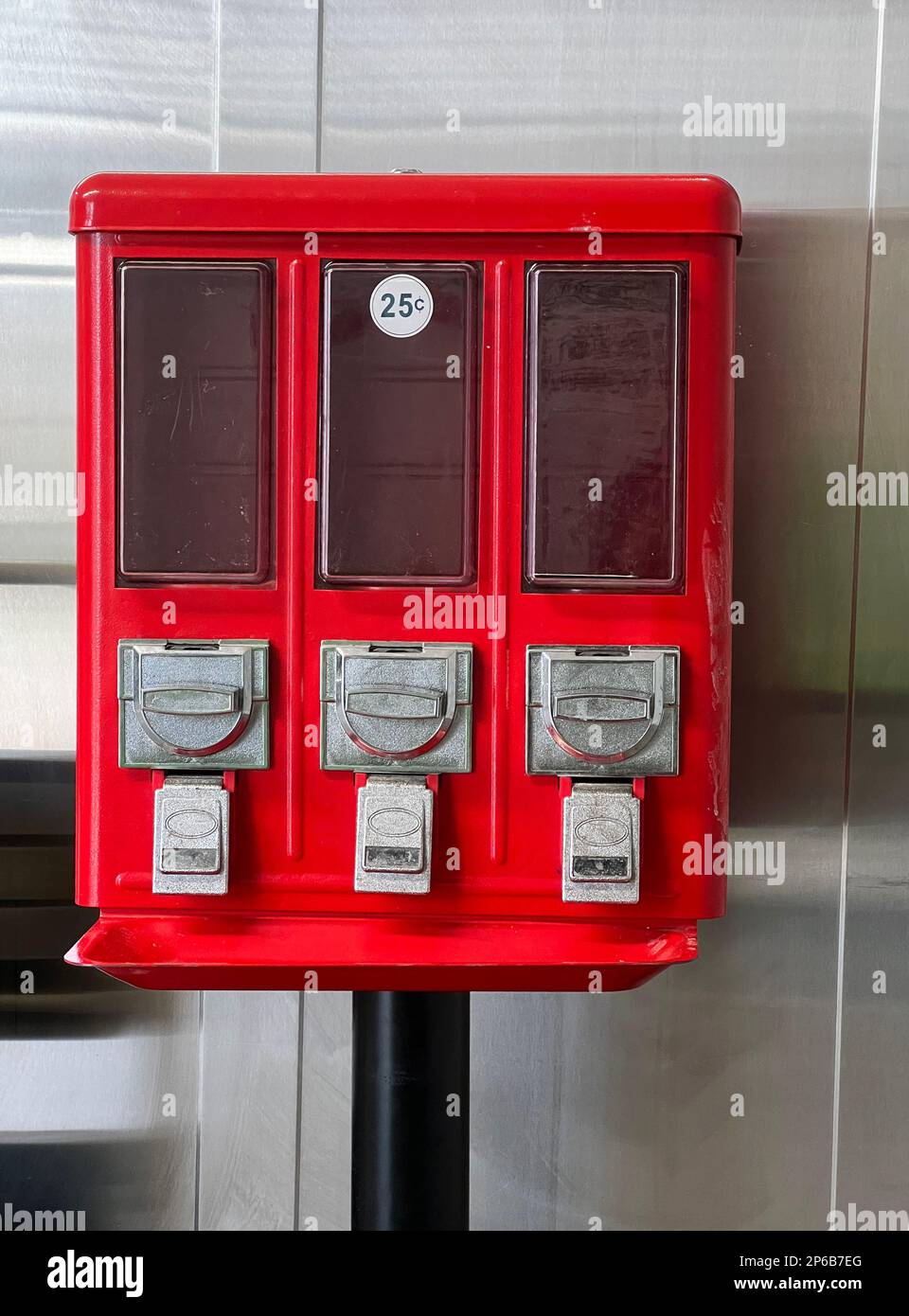 An empty candy dispenser illustrates the concept of supply and demand and inventory management. Stock Photo