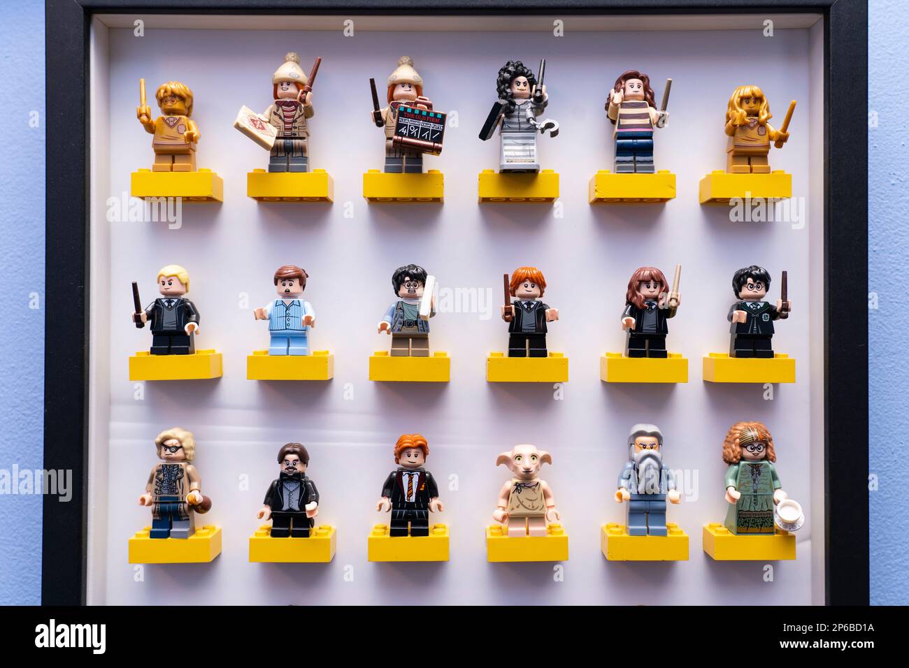Harry Potter themed lego figures and characters from lego's Wizarding World series standing on lego bricks in a wall mounted picture frame. UK Stock Photo