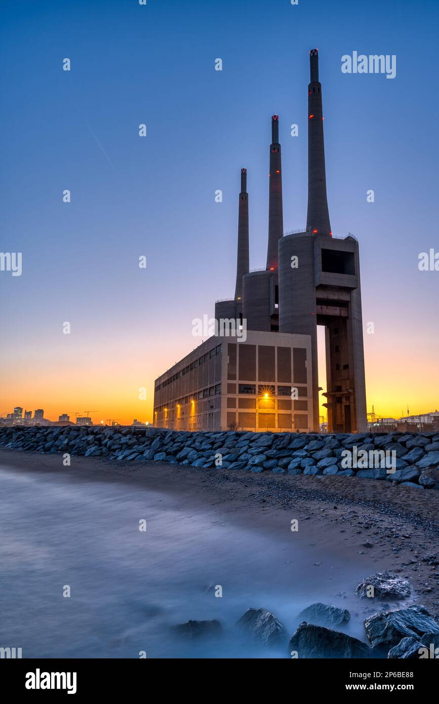 The decommissioned thermal power station at Sant Adria near Barcelona after sunset Stock Photo