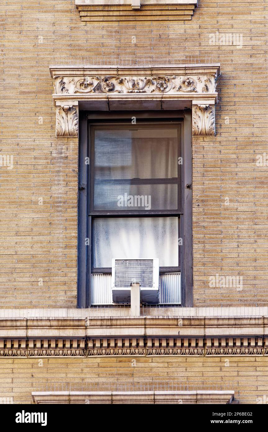 White terra cotta decorates the features of this tan roman brick