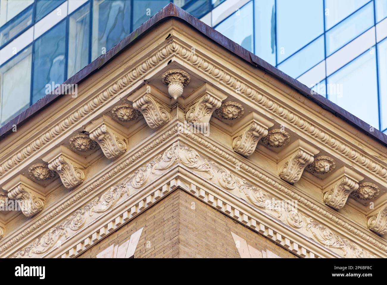 White terra cotta decorates the features of this tan roman brick