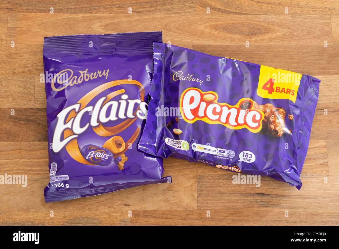 A packet of Cadbury chocolate eclairs and a pack of Cadbury picnic chocolate bars. Theme: market leader, Cadbury brand, chocolate confectionary Stock Photo