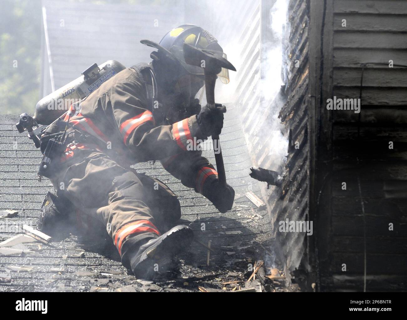 Grand Rapids firefighters work at 1135 Cromwell Avenue SE in Grand ...