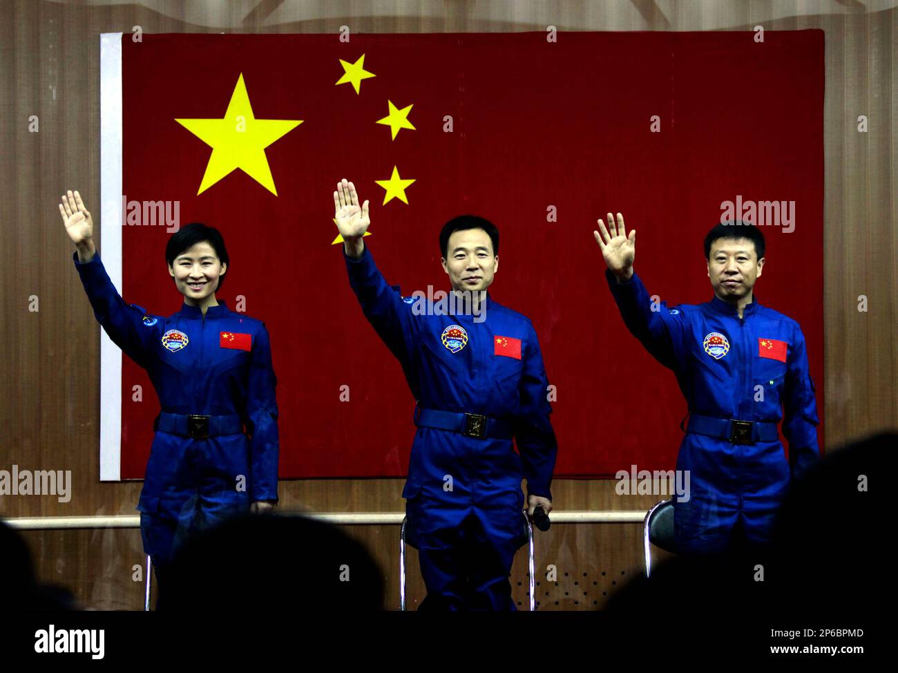 From left, Chinese astronauts Liu Yang, Jing Haipeng and Liu Wang wave ...
