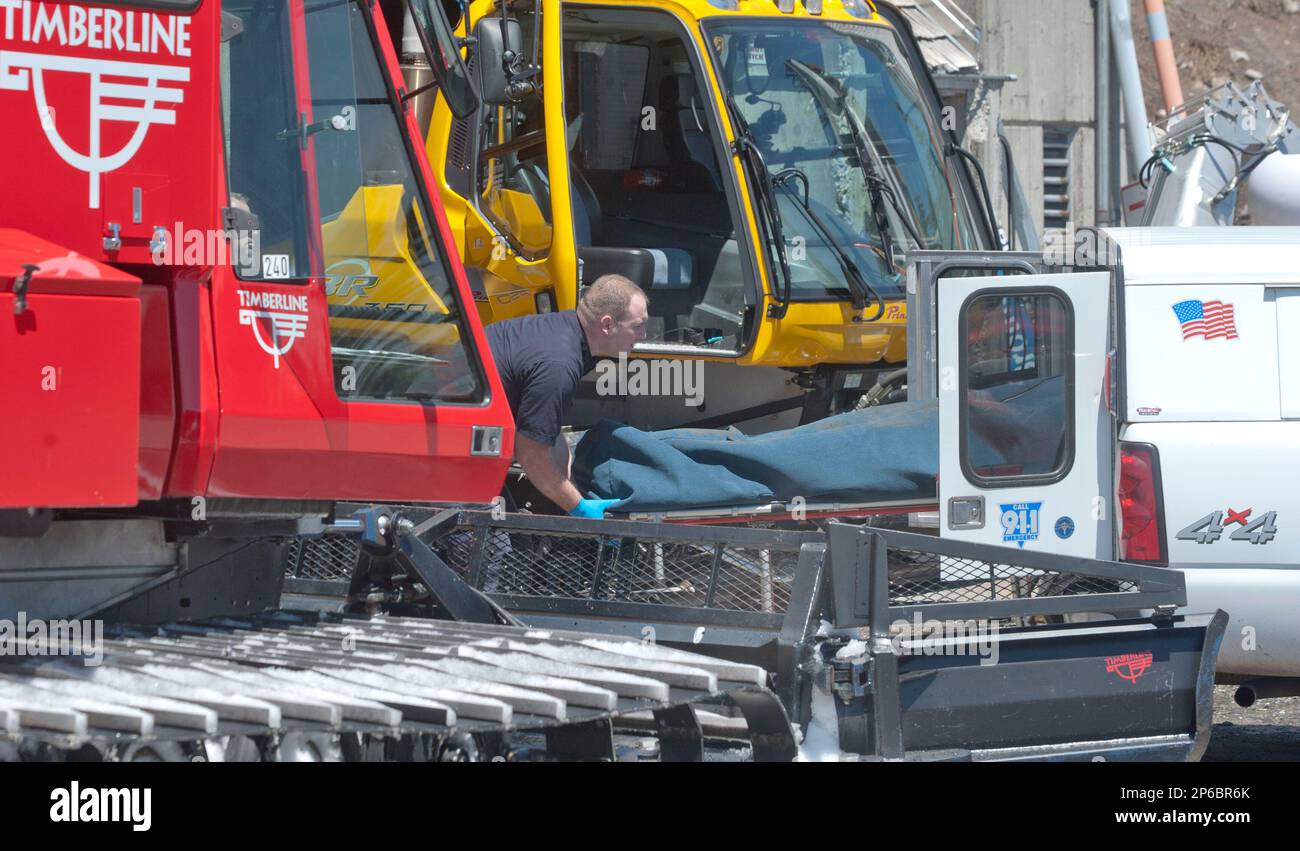 The body of Mark Cartier 56 is moved after being brought down