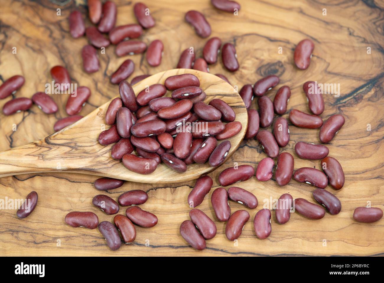 dried red kidney beans on olive wood Stock Photo Alamy