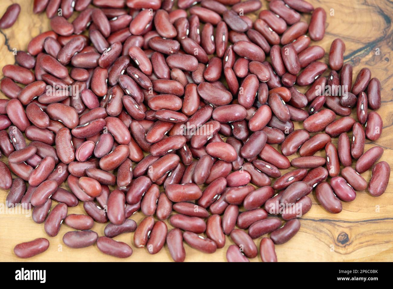 dried red kidney beans on olive wood Stock Photo Alamy