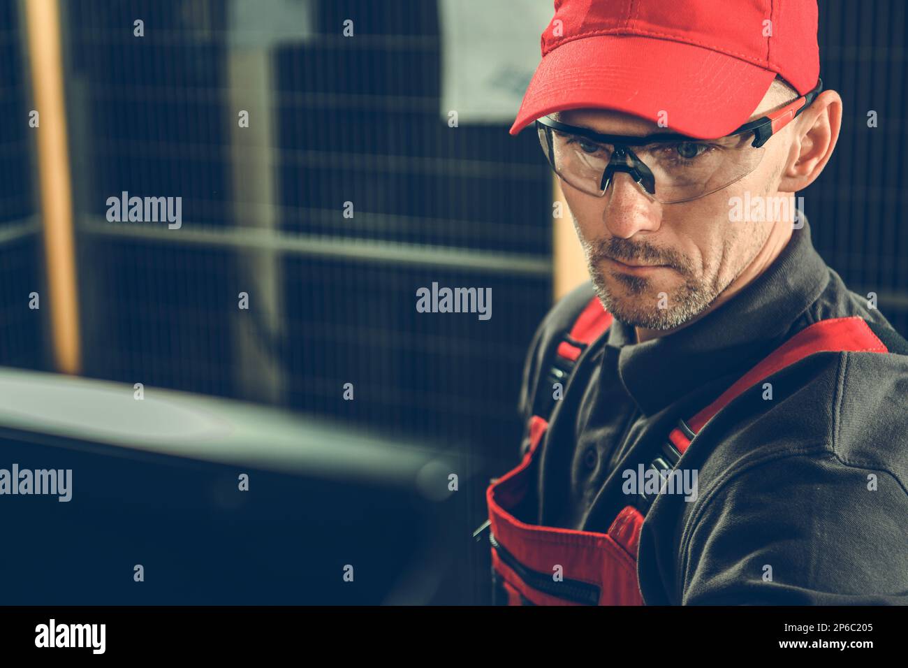 Caucasian Factory Production Line Operator in His 40s Portrait. Wearing Eyes Protection Glasses and a Hat. Stock Photo
