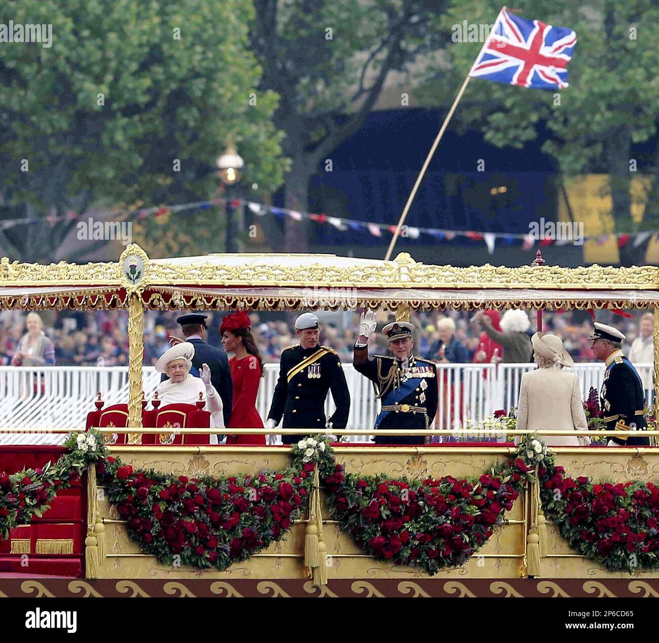 British Queen Elizabeth (L) gets aboard a ship during the Thames