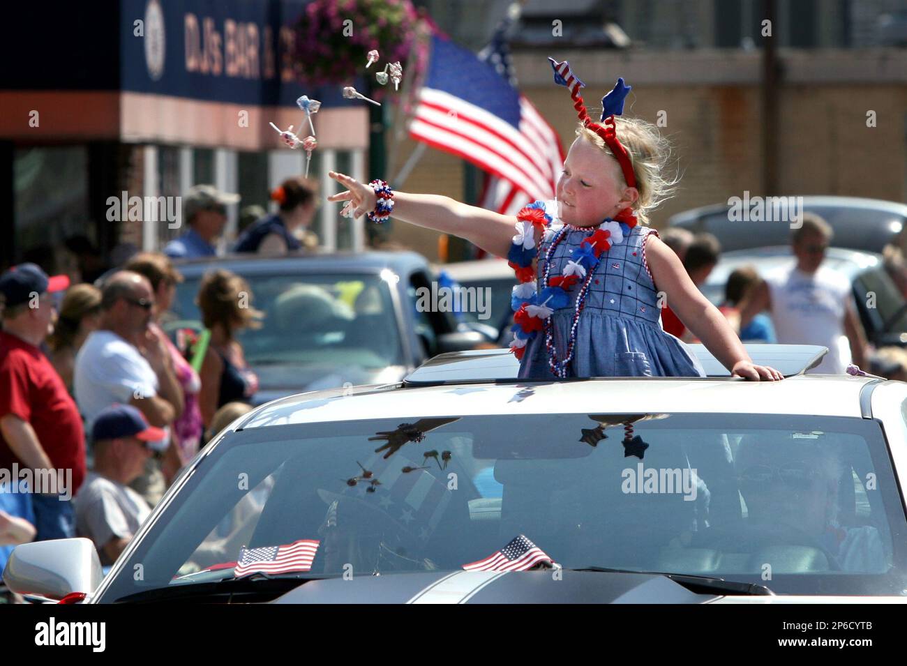 Makala Lappin, 6, from Alton, Ill., stands up in the sunroof of her