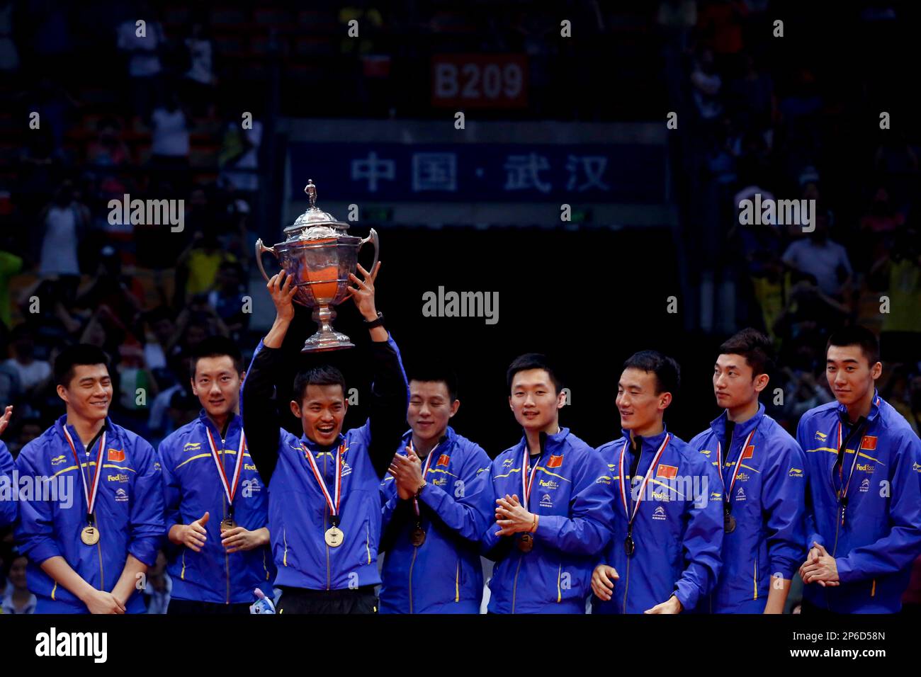 Chinese players celebrate with the trophy during the award ceremony of the Thomas Cup badminton championship in Wuhan in central Chinas Hubei province on Sunday, May 27, 2012