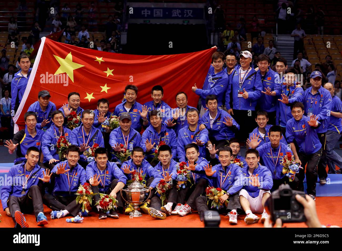 Chinese players pose for a group picture after winning the Thomas Cup badminton championship in Wuhan in central Chinas Hubei province on Sunday, May 27, 2012