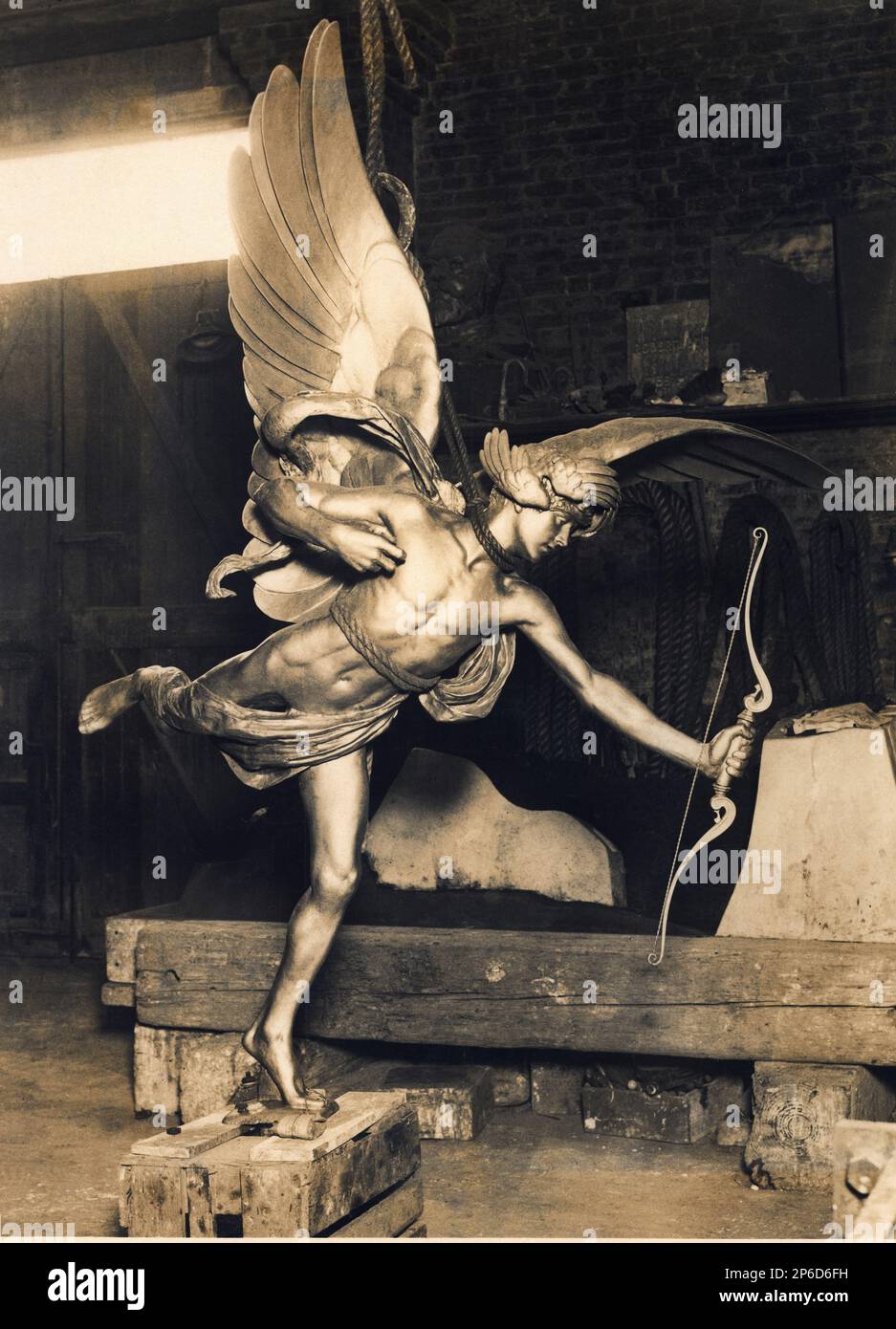 1931 , september , London , GREAT BRITAIN : The celebrate EROS statue on PICADILLY CIRCUS fountain , artwork by gay victorian sculptor ALFRED GILBERT ( 1854 - 1934 ) , left the foundry at Thames Ditton after a restoration and return to take up it's old position . In February 1925, when the removal of the monument for the construction of the new tube station threatened their livelihood . After the removal of the memorial, Eros was erected in the Embankment Gardens on a concrete stand, while the base was stored at No. 195 Clapham Road.  Although the monument was not replaced for nearly seven yea Stock Photo