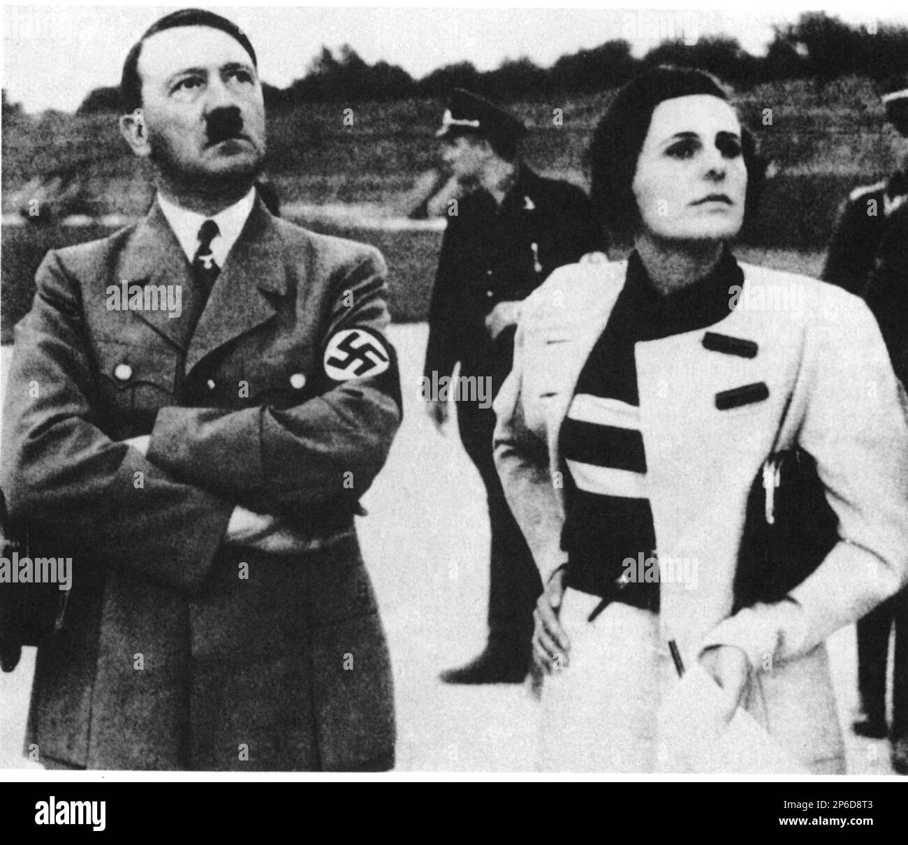 1934 , BERLIN , GERMANY : LENI RIEFENSTAHL ( 1902 - 2003 ) german actress and woman movie director with dictator ADOLF HITLER discussing the preparations for the Sixth days Nazist Party Rally in Nuremberg . From this event Leni Riefenstahl filming the most celebrated documentary TRIUMPH OF THE WILL ( 1935 - Il trionfo della volontà  ). - NAZI DIVA - NAZIST - NAZISTA - NAZISMO - VAMP - regista cinematografico - ritratto - WWII - SECONDA GUERRA MONDIALE - 2nd World War - documentario - documentarismo ----  Archivio GBB Stock Photo