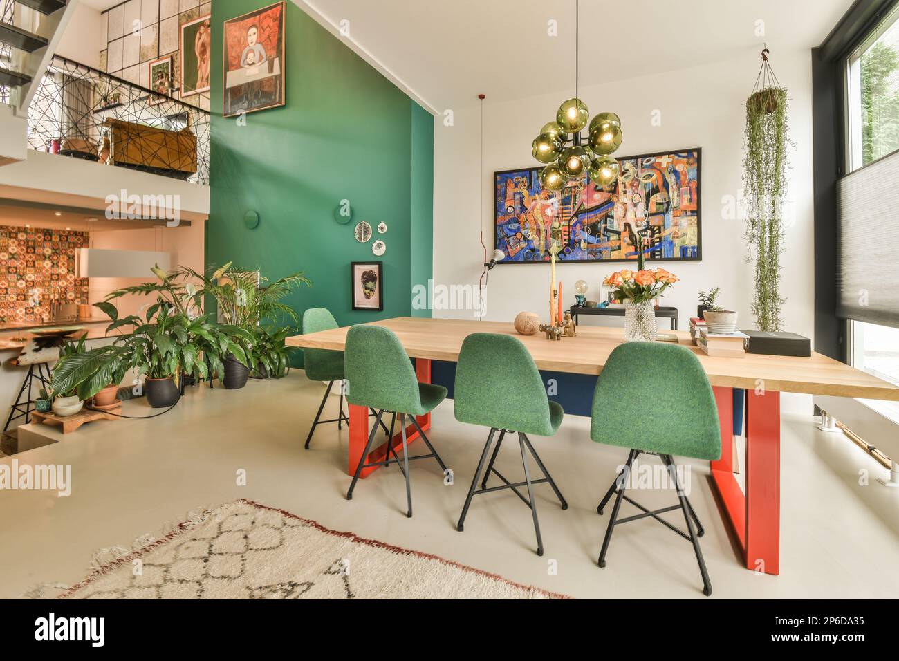 a living room with green walls and white flooring in the center of the