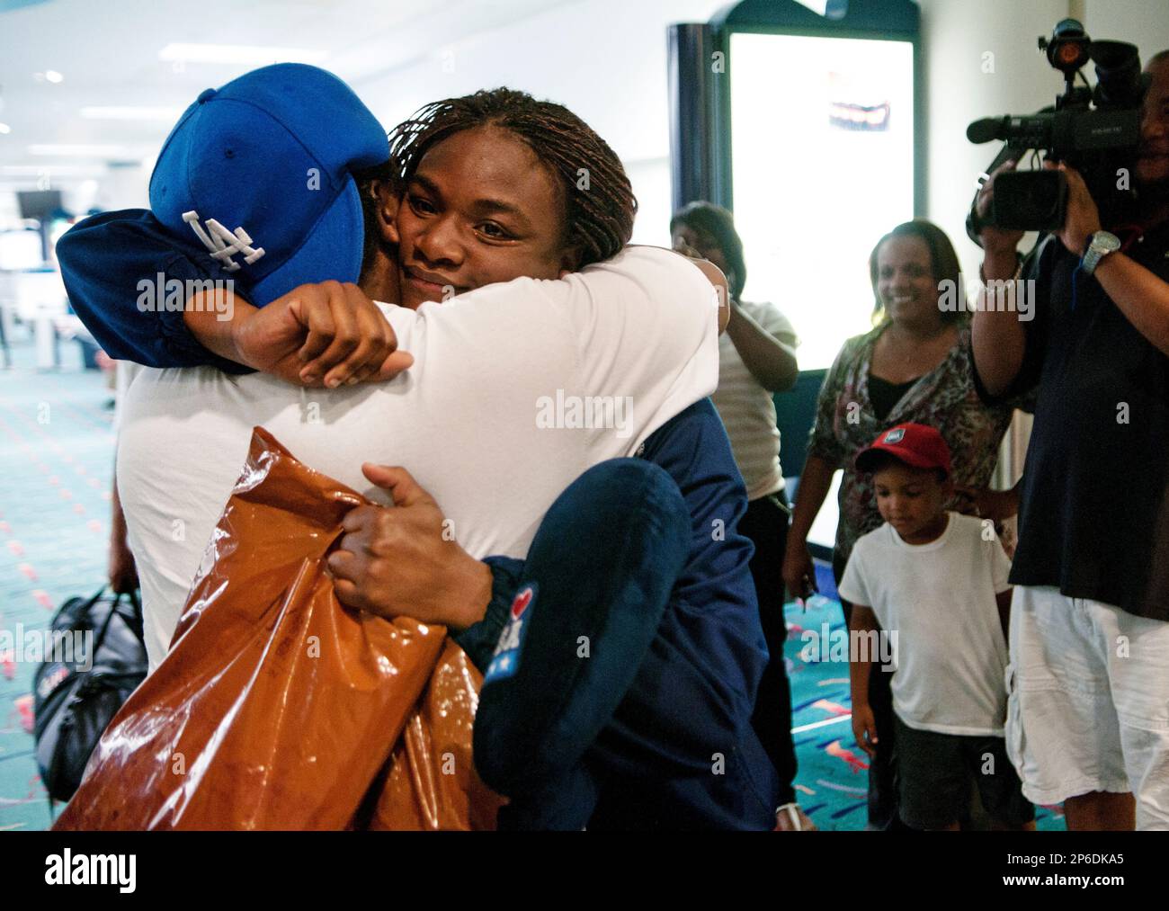 Claressa Shields embraces her trainer, Jason Crutchfield, after her