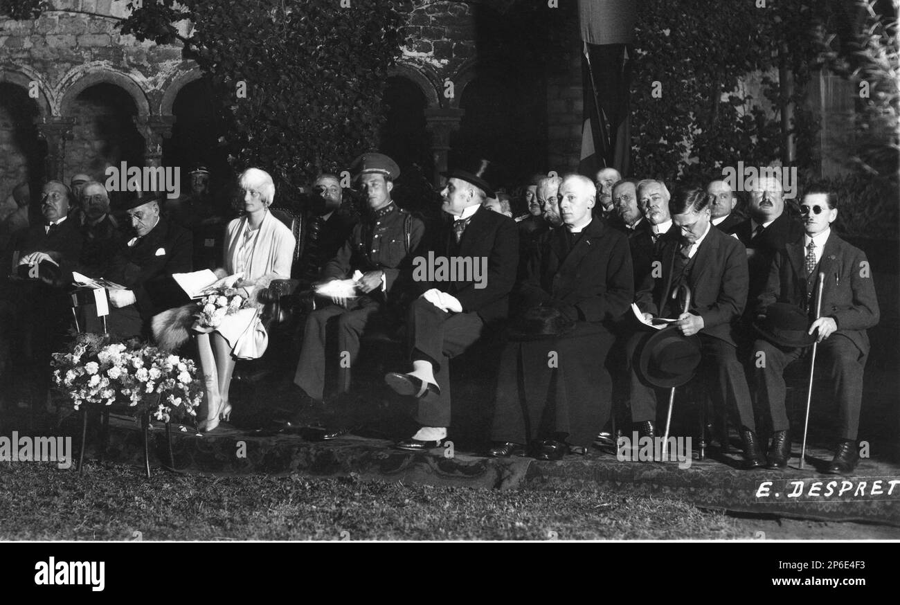 1928 , Belgium  : The future Queen ASTRID of BELGIUM ( born princesse of Sweden , 1905 - dead in car wreck near Kussnacht , Switzerland 29 august 1935 ) and the housband  the future King LEOPOLD III of Belgians   SAXE COBURG GOTHA ( 1901 - 1983 )  at inauguration  Concert de Carillon at Sainte Gertrude Church, Nibelles .  In this photo ( by E. Despret ) from left to right : Pierre de Burlet ( politician ) , Toussaint , Astrid of Belgium , Leopold of Belgium , Delcroix ( Bourgumastre of Nibelles ), l'Abbé Mary ( Doyen of Sainte Gertrude ) , Monsieur Lambert, (in 2nd line), Lambotte (judge from Stock Photo