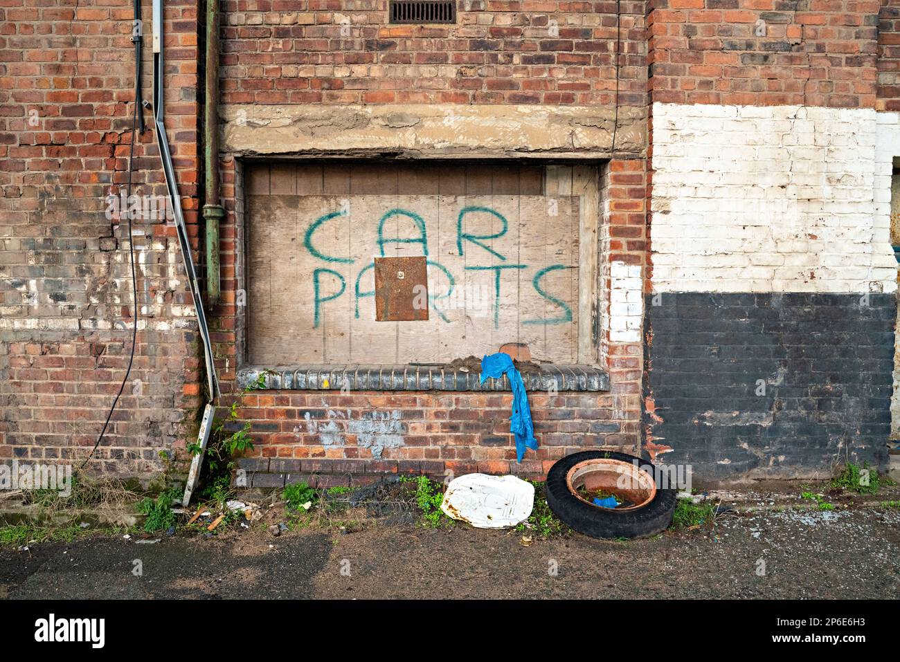'Car Parts' painted on loading bay, Dockland Warehouse, Liverpool, UK Stock Photo