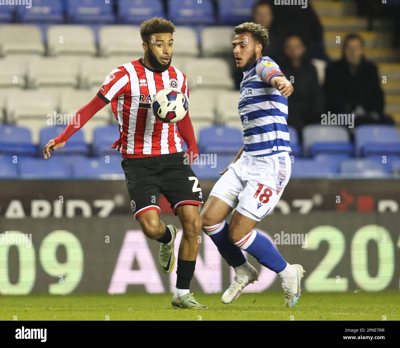 Reading, England, 7th March 2023.  Jayden Bogle of Sheffield Utd takes on Nesta Guinness-Walker of Reading during the Sky Bet Championship match at the Select Car Leasing Stadium, Reading. Picture credit should read: Paul Terry / Sportimage Stock Photo