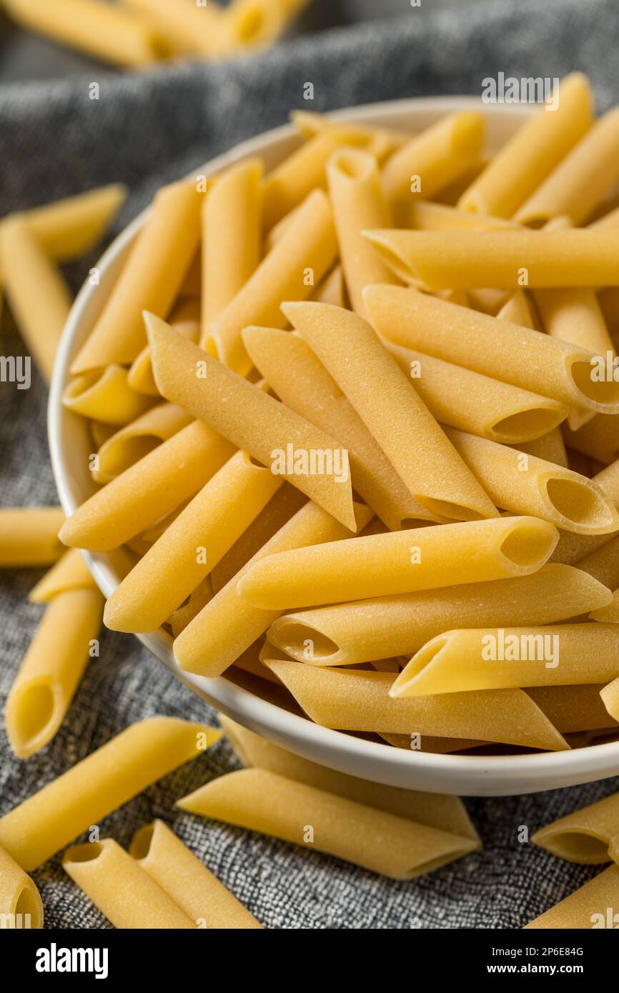 Raw Dry Mostaccioli Penne Lisce Pasta in a Bowl Stock Photo Alamy