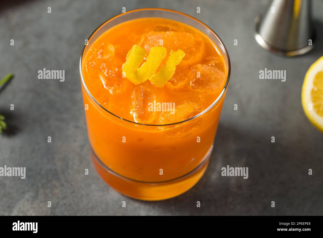 Cold Boozy Raw Carrot Bourbon Cocktail with Lemon Juice Stock Photo Alamy