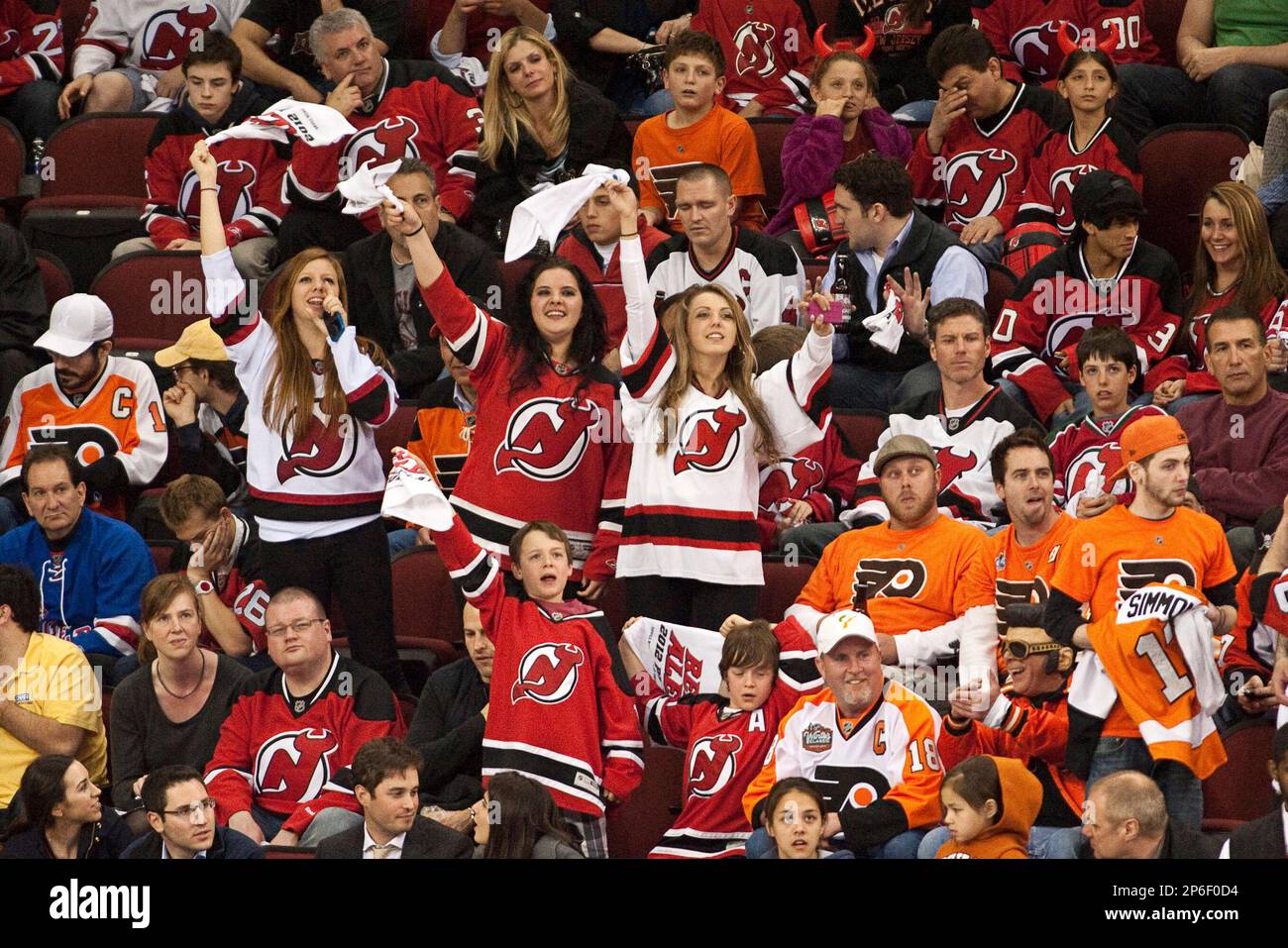 May 3 2012: Devils' fans cheer while flanked by Flyers' fans