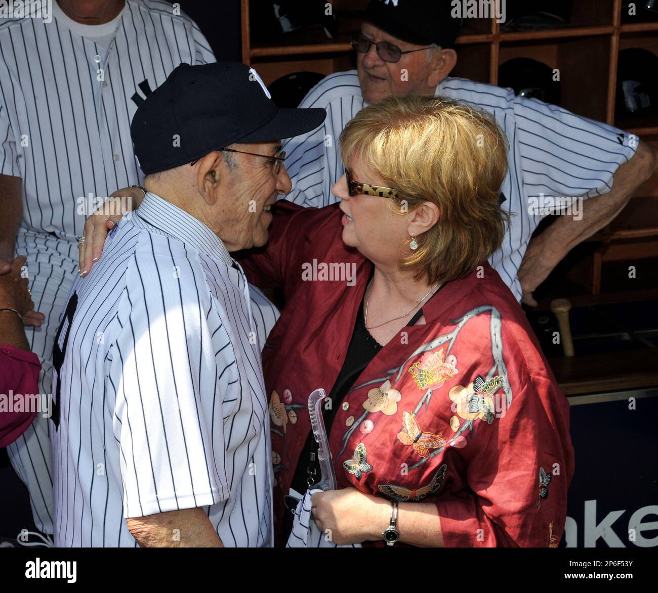 Former New York Yankees star catcher Yogi Berra and Diana Munson (the late  Thurman Munson's wife) during Old Timers Day at Yankee Stadium on June 26,  2011 in Bronx, NY. (AP Photo/Tomasso