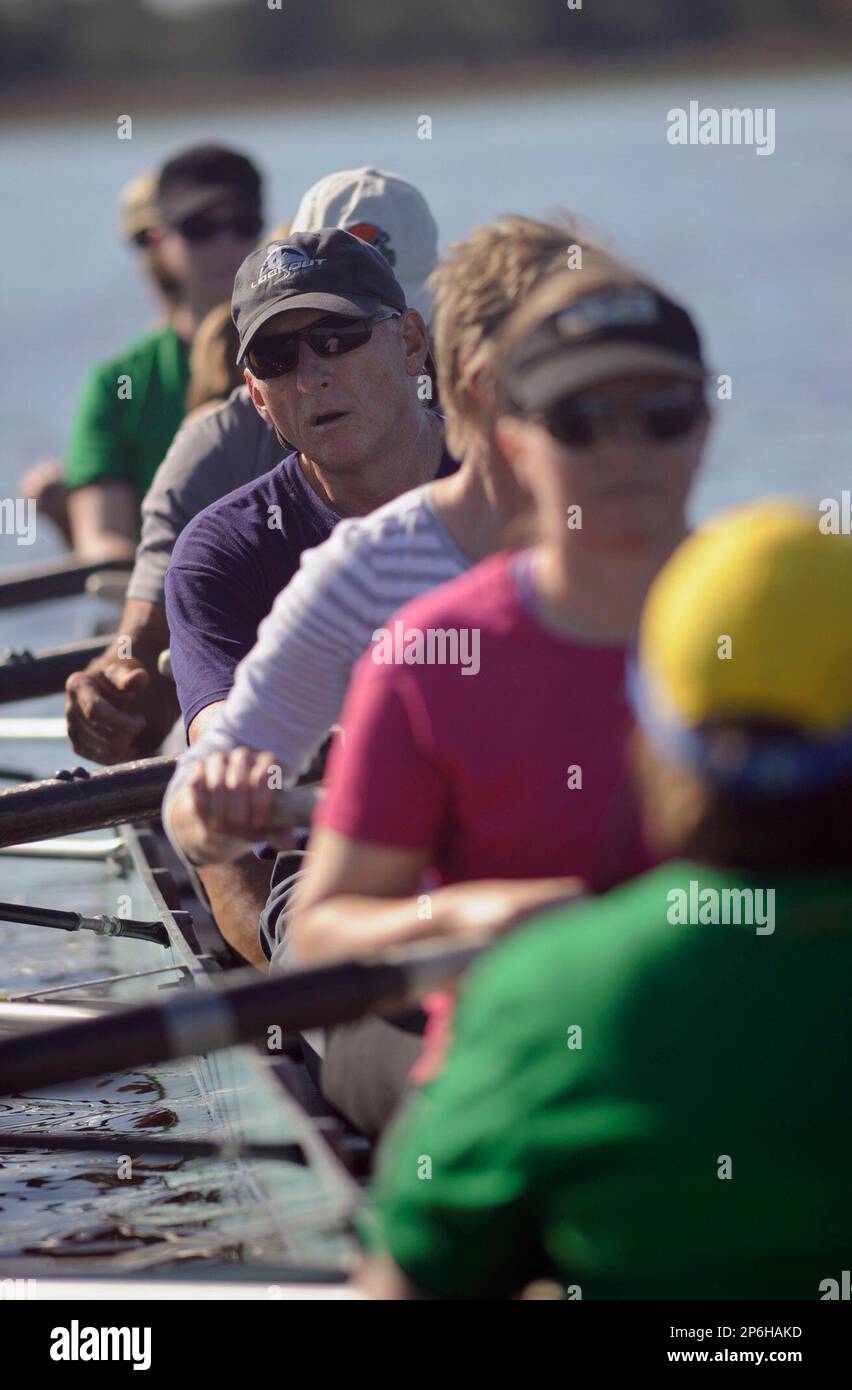 Cape Fear Rowing student Brent McAbee peaks over the shoulders of his
