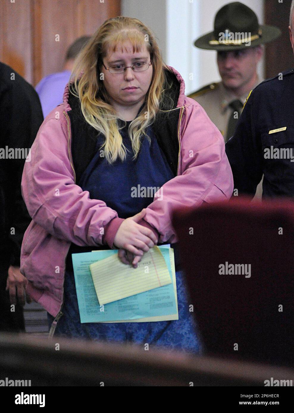Patricia Prue is led into court Wednesday, March 28, 2012 in St