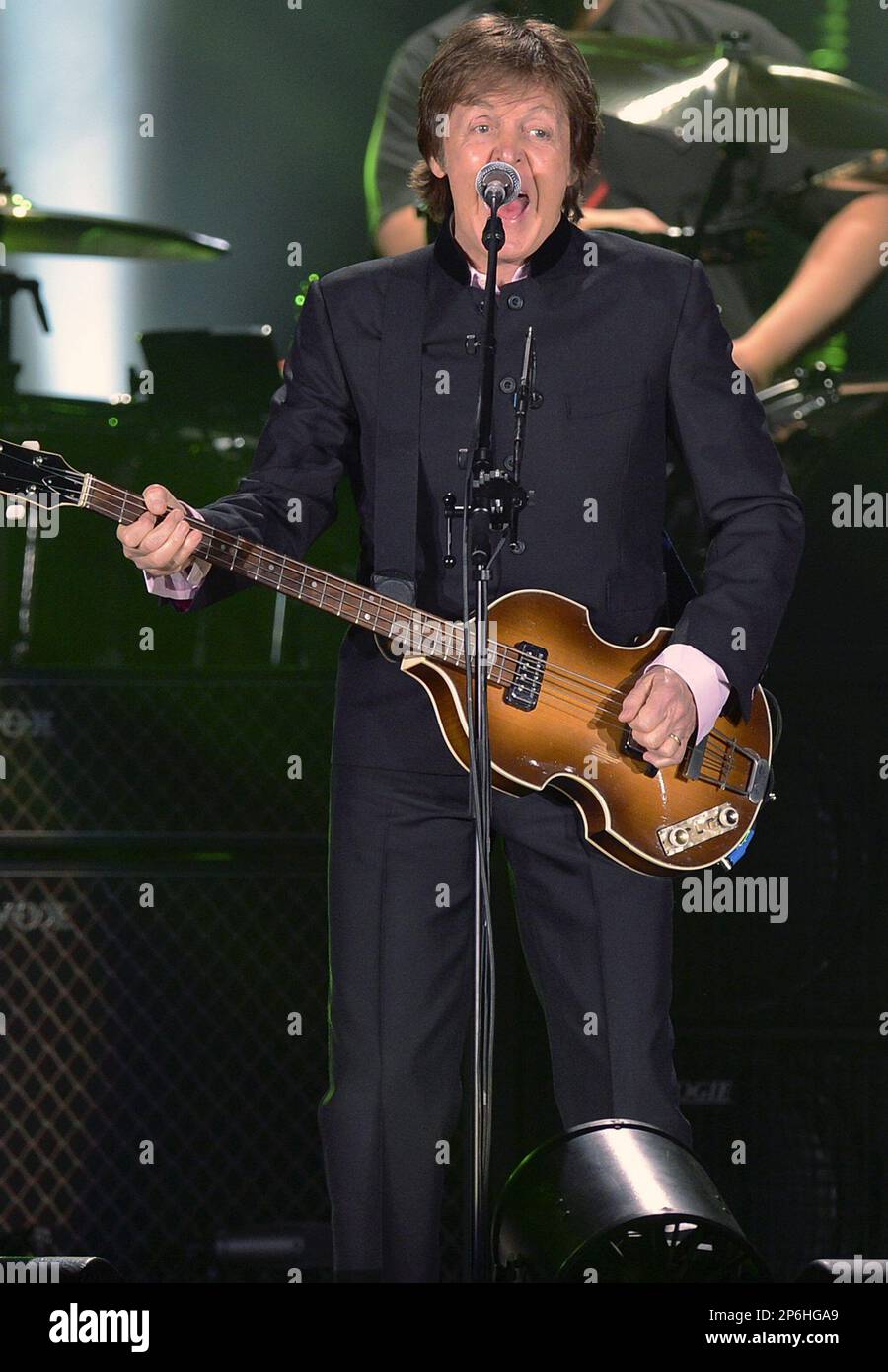 In this picture taken Monday night, March 26, 2012, British legendary musician Paul McCartney performs during a concert in Zurich, Switzerland. (AP Photo/Keystone/Walter Bieri) Stock Photo