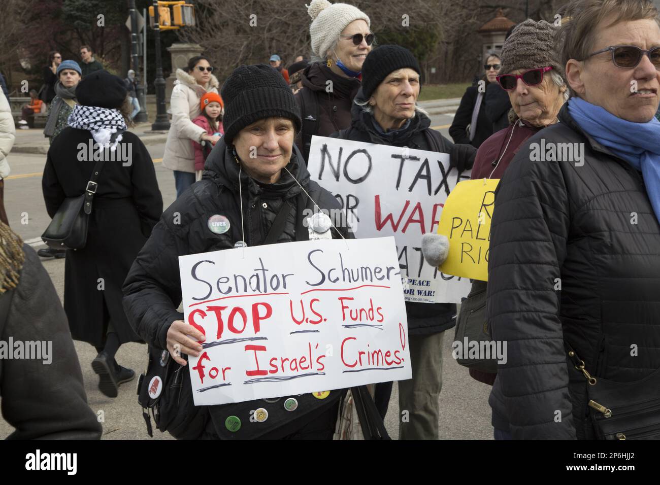 Jews and others rally & march in Brooklyn near Senator  Chuck Schumer's home demanding the US cut military funding to Israel in light of attacks and killing Palestinian civilians and destroying homes and Palestinian property in the West Bank and elsewhere. Stock Photo