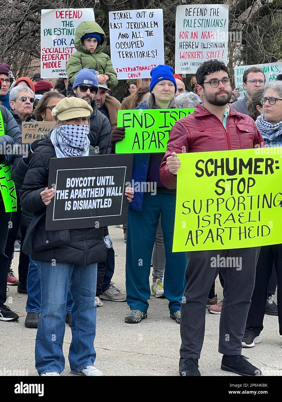 Jews and others rally & march in Brooklyn near Senator  Chuck Schumer's home demanding the US cut military funding to Israel in light of attacks and killing Palestinian civilians and destroying homes and Palestinian property in the West Bank and elsewhere. Stock Photo