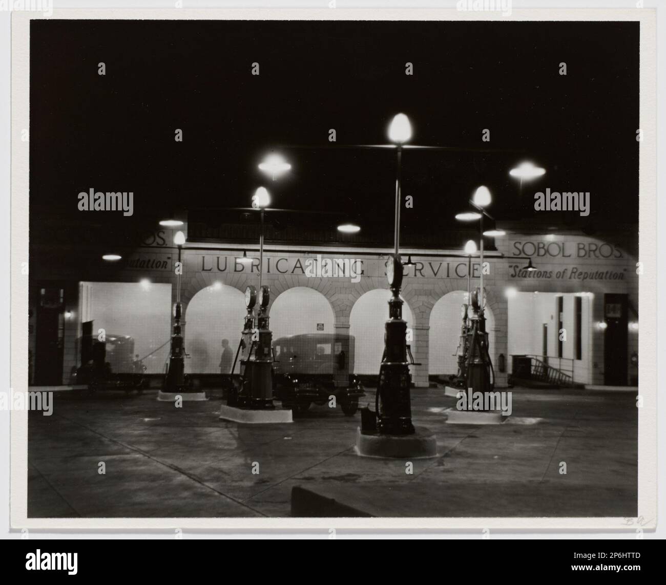 Berenice Abbott, Gasoline Station at Night, New York , 1931, printed 1982, gelatin silver print. Stock Photo