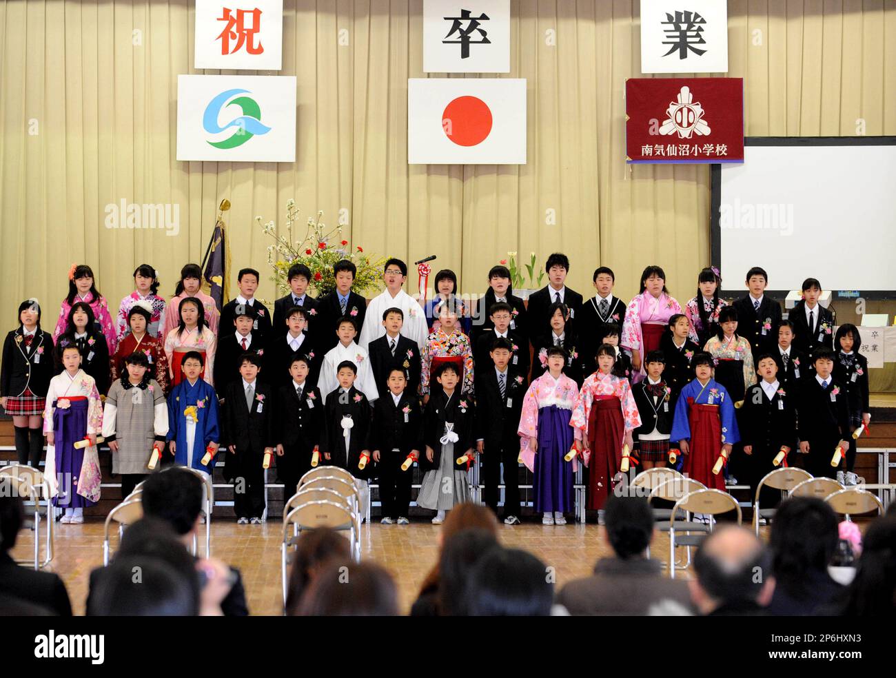 The sixth-grade students of Minami Kesennuma Elementary School, attired in Japanese  formal dress hakama, attend their graduation ceremony in Kesennuma, Miyagi  Prefecture, on March 19, 2012. The elementary school, hit by the