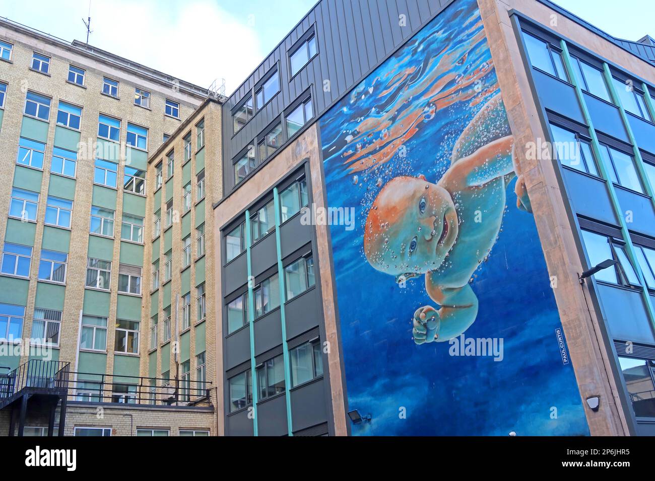 Artist Paul Curtis, painting of baby Ethan, swimming mural in Harrington St, Liverpool, Merseyside, England, UK, L2 9QF Stock Photo