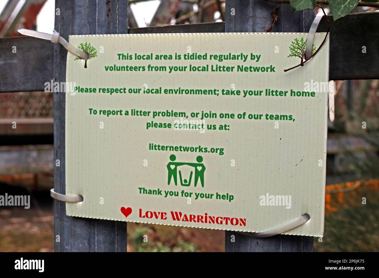 Love Warrington, a notice on the TPT TransPennine trail, example of a local environment area tidied by local community volunteers Stock Photo