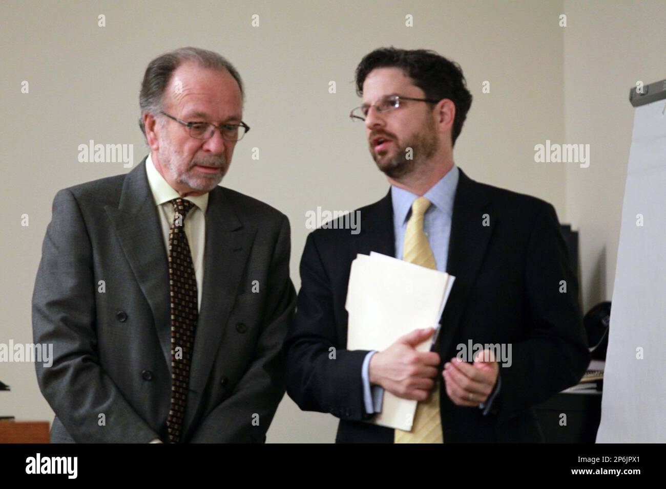 Defense attorneys Steven Altman, left, and Philip Nettl confer, Friday,  March 9, 2012 in New Brunswick, N.J. Dharun Ravi, 20, is accused of using a  webcam for the central crime, then using, image size:1300x956