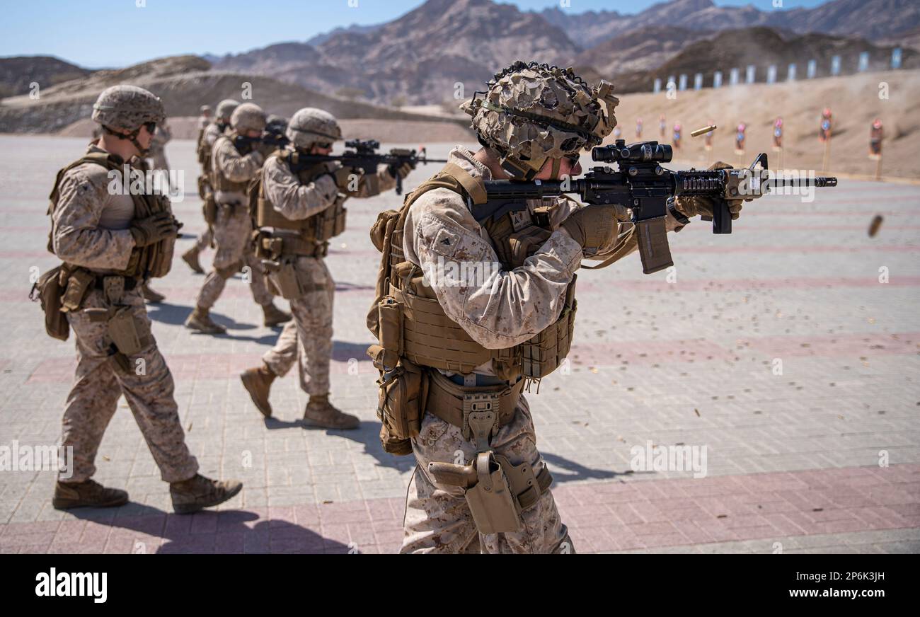 OMAN (February 19, 2023) – A U.S. Marine assigned to Fleet Anti-Terrorism Security Team Central Command (FASTCENT) engage targets while moving during a live fire range as part of exercise Invincible Sentry 23 in Oman Feb. 19. IS23 is a recurring exercise held with different partner nations each year within U.S. Central Command’s area of responsibility to evaluate the readiness and capabilities of U.S. and Omani forces responding to a regional emergency. (U.S. Marine Corps photo by Staff Sgt. Benjamin McDonald) Stock Photo