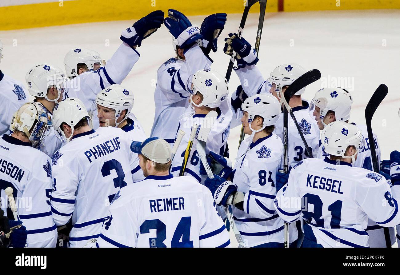 Toronto Maple Leafs players celebrate after beating the Montreal