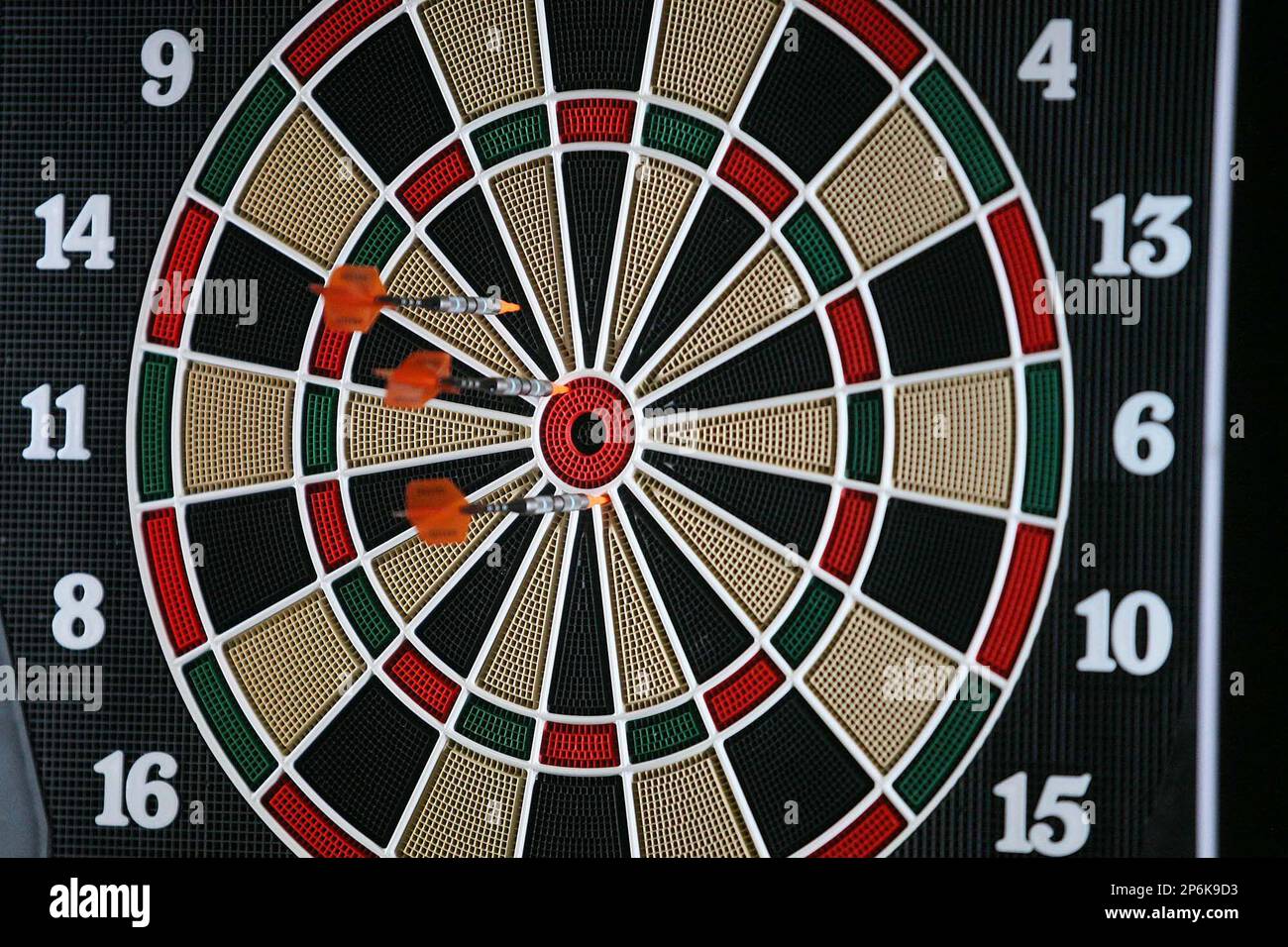 In this Feb. 26, 2012 photo, darts are thrown onto the board during the  27th Annual South Dakota State Dart Tournament at the Rushmore Plaza Civic  Center in Rapid City, S.D. With