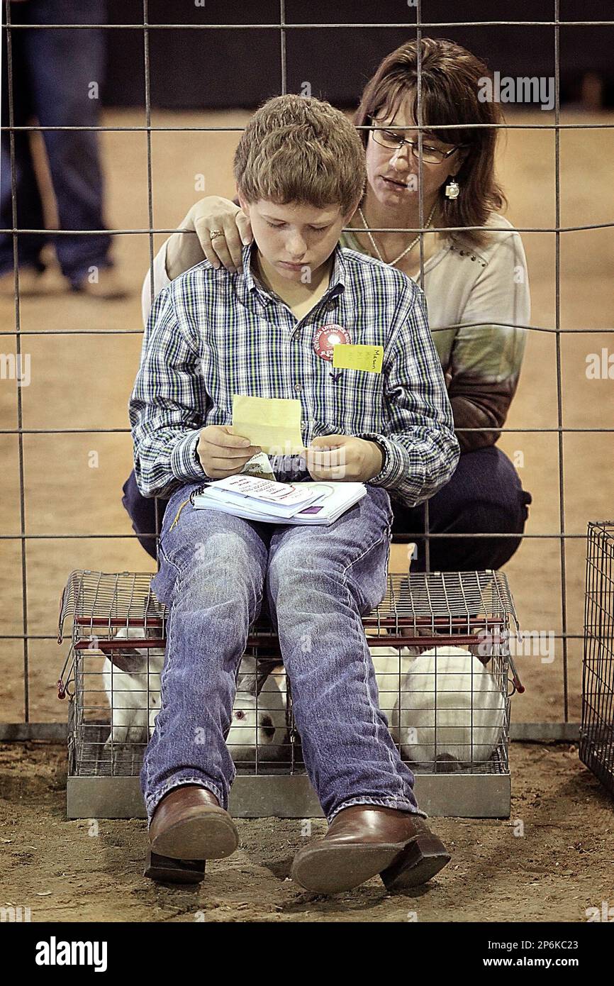 Danielle Warzecha from Vanderbilt, Texas comforts her son Mason