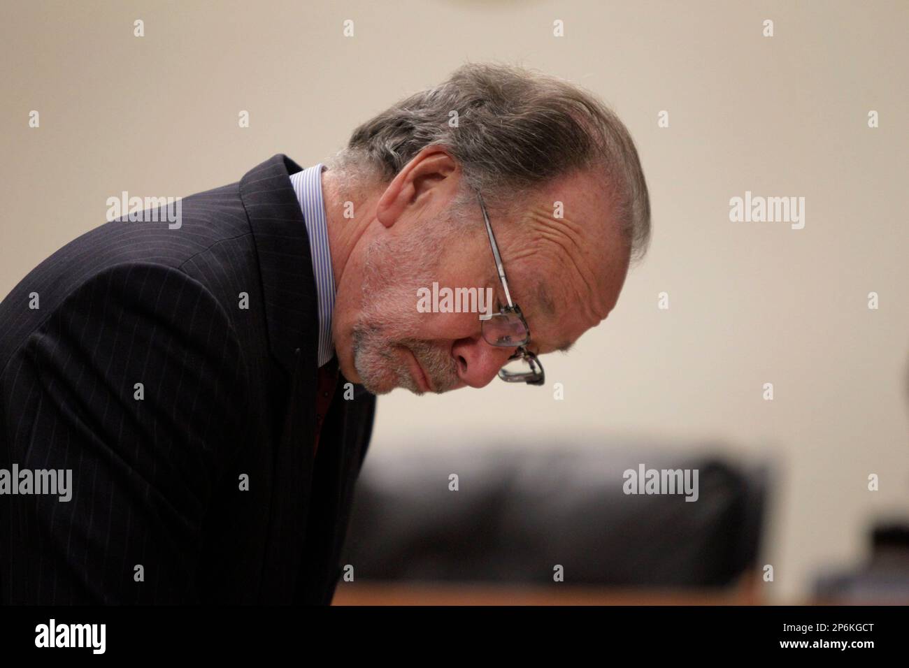 Defense attorney Steven Altman looks over paperwork during the trial of
