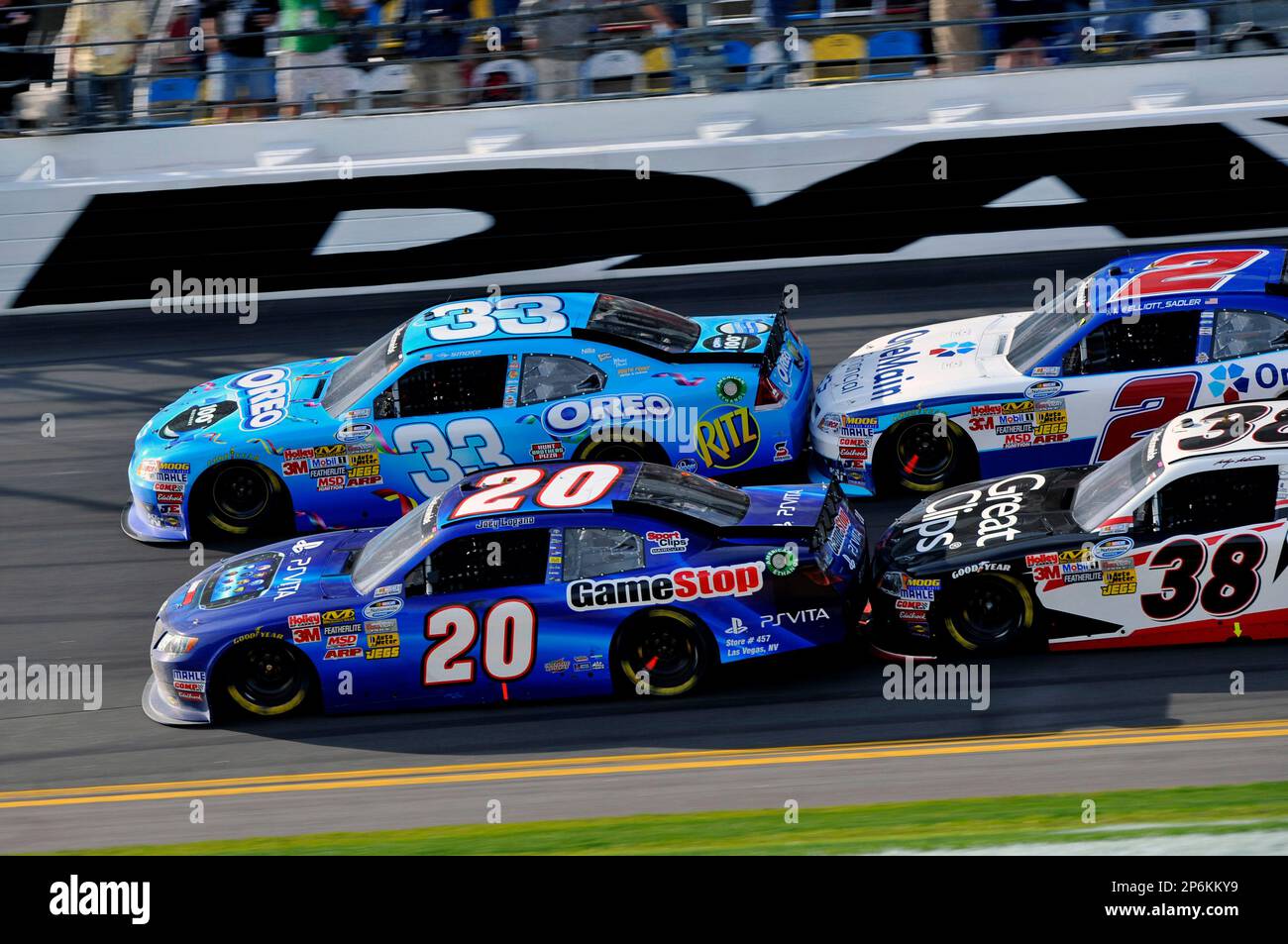 Joey Logano, GameStop Toyota Camry (20) and Tony Stewart (33 