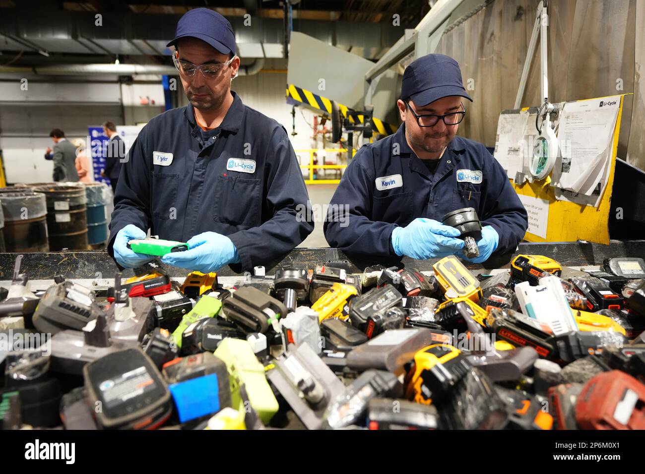 LiCycle workers sort lithium ion rechargeable batteries at the company